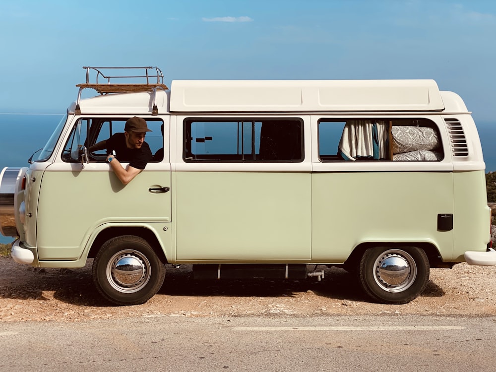 white and black volkswagen t-2 van