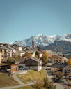 brown and white houses near mountains during daytime