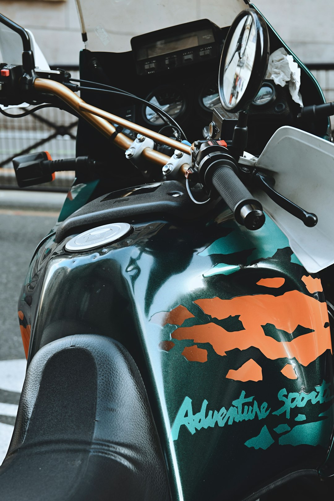 black motorcycle with white and green camouflage print