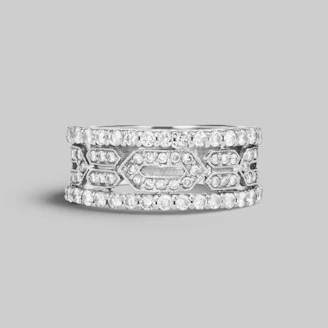 Elegant silver and platinum rings stacked together, highlighting their shine and craftsmanship