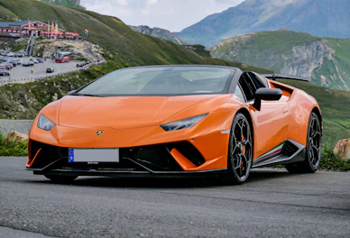 orange lamborghini aventador on road during daytime