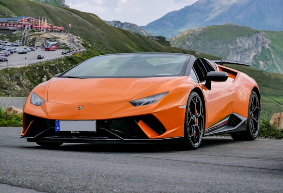 orange lamborghini aventador on road during daytime