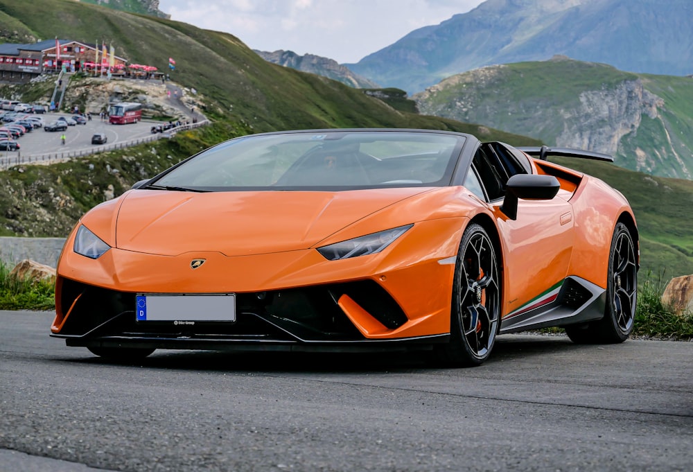 orange lamborghini aventador on road during daytime