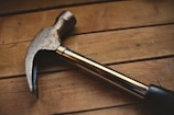 black and silver claw hammer