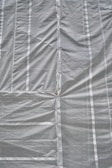 A folded tarpguard tarp showing its compactness and portability.
