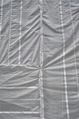 A folded tarpguard tarp showing its compactness and portability.