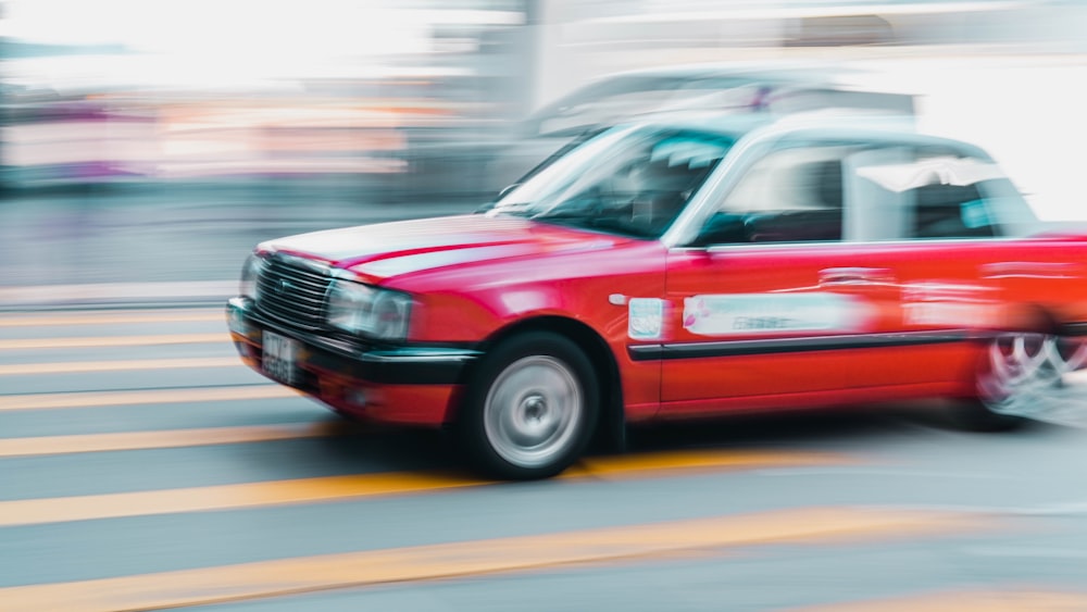 red honda car on road during daytime