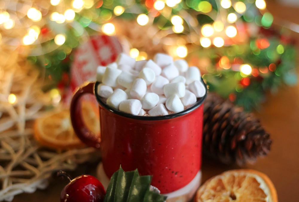 red ceramic mug with white and red round beads