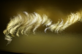 Golden-hued abstract representation of light waves and skin cells
