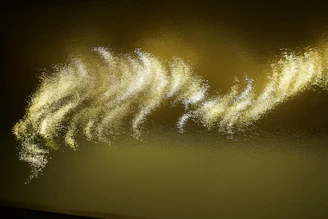 Soft glowing golden light waves ripple over a black background, suggesting harmonic resonance.
