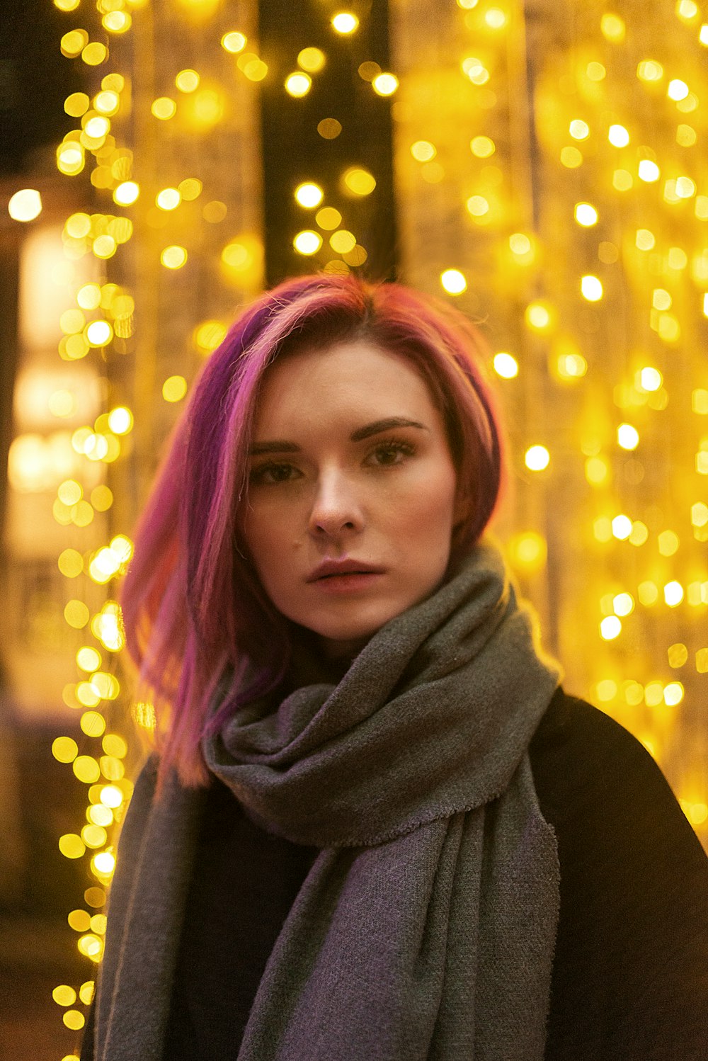 woman in gray scarf and black coat