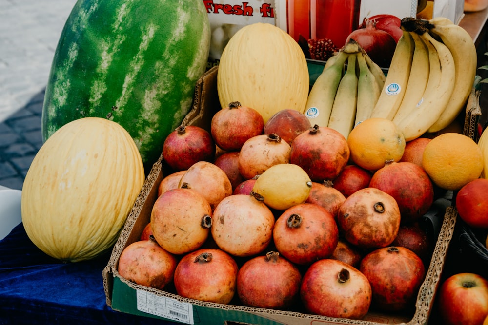 red apples on white wooden crate