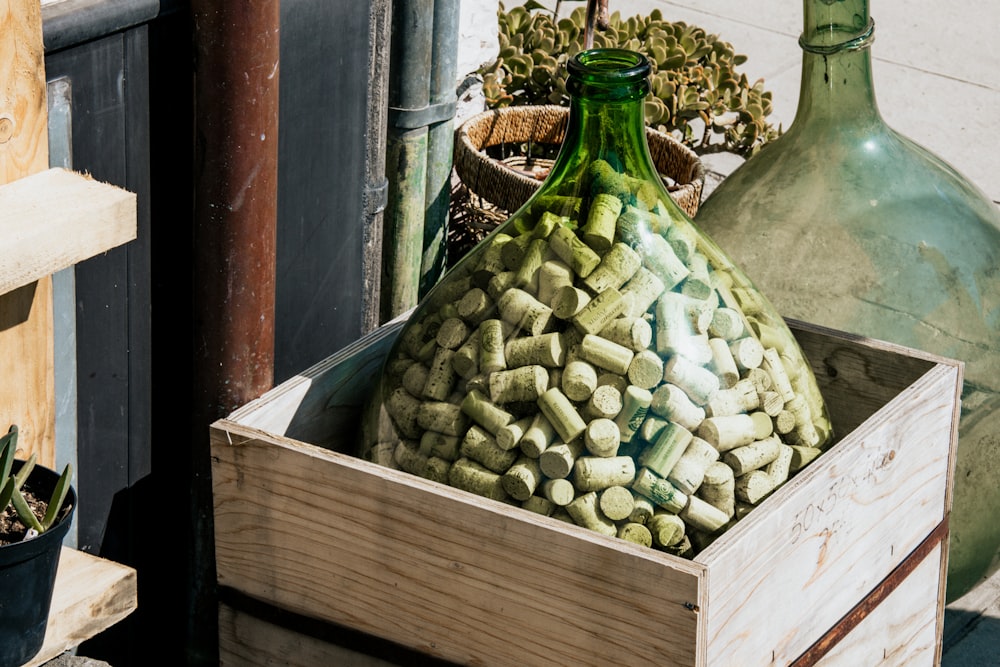 green round fruit on brown wooden crate