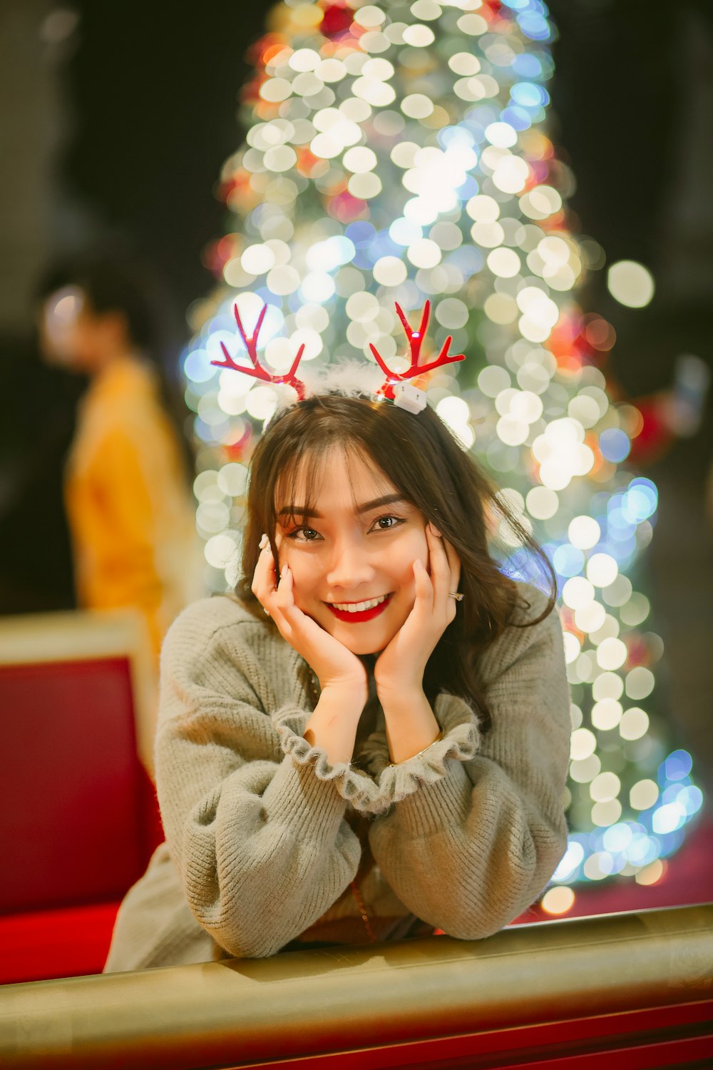 woman in brown coat smiling