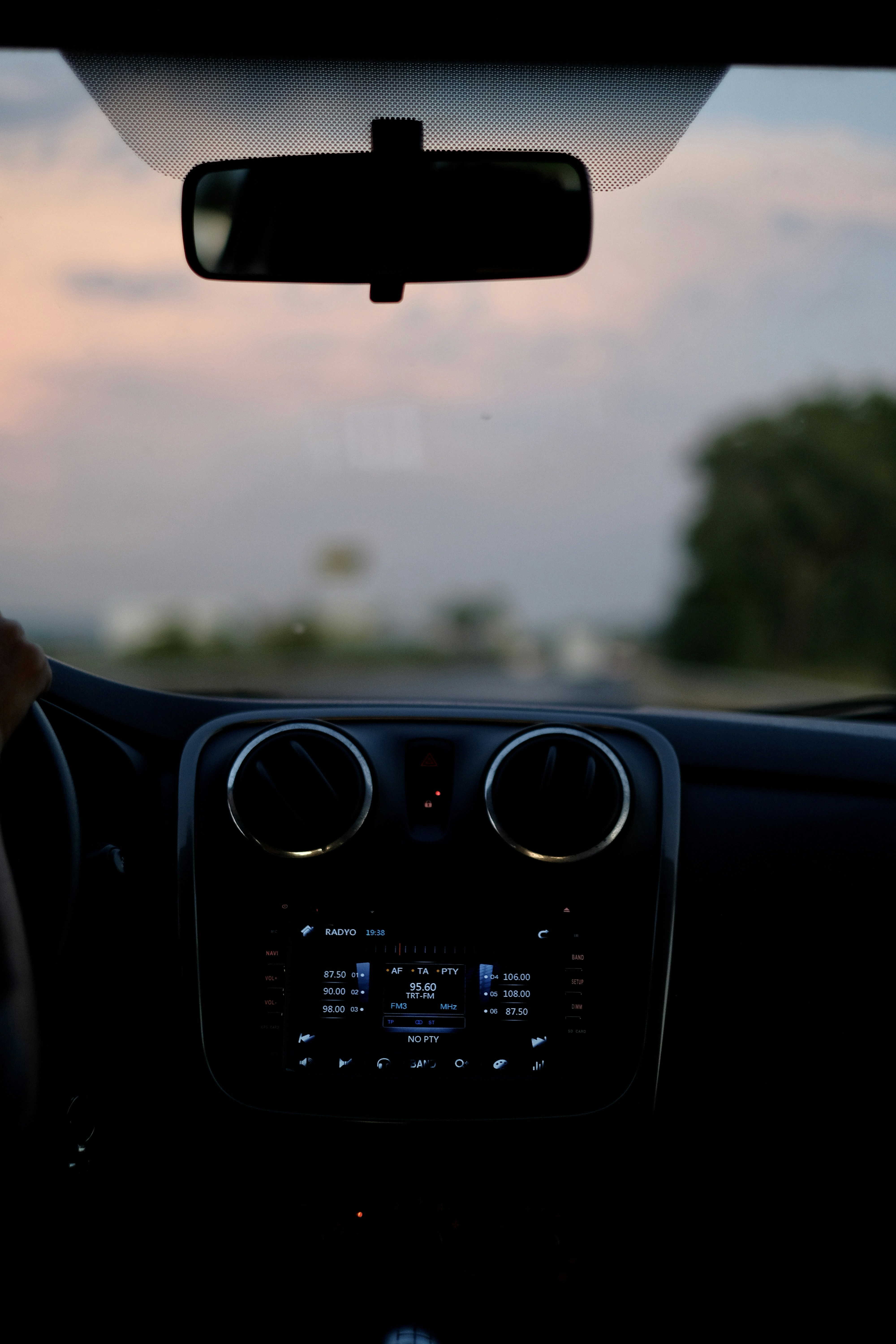 person driving car during daytime
