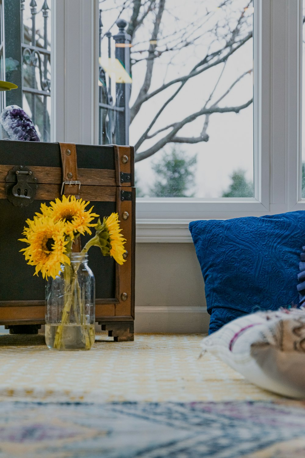 yellow flower in clear glass vase