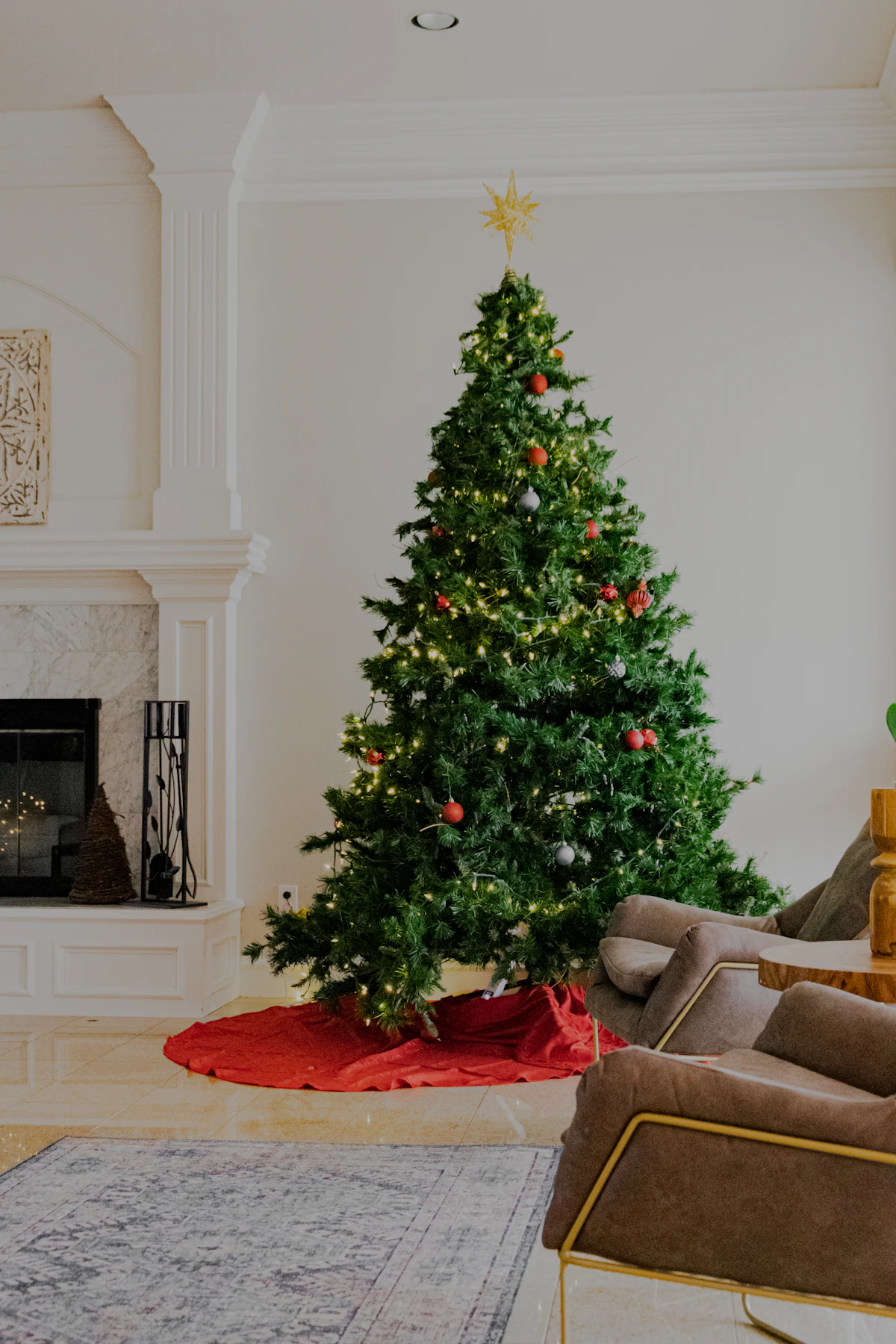 Close-up of a green Christmas tree with baubles and lights