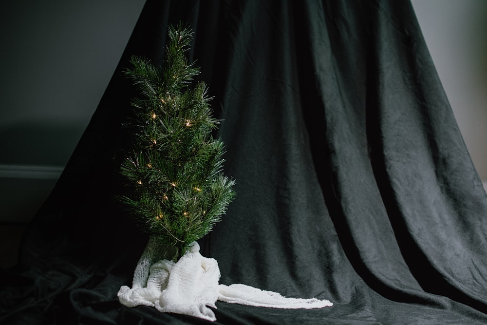 green christmas tree with white angel ornament