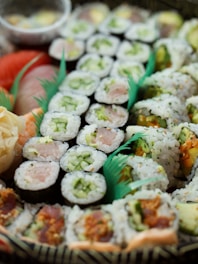 Artfully arranged sushi rolls showcasing colorful fresh fish and vegetables.