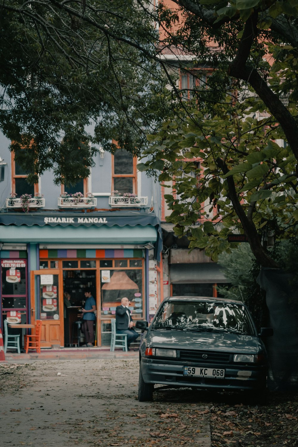 black suv parked in front of store during daytime