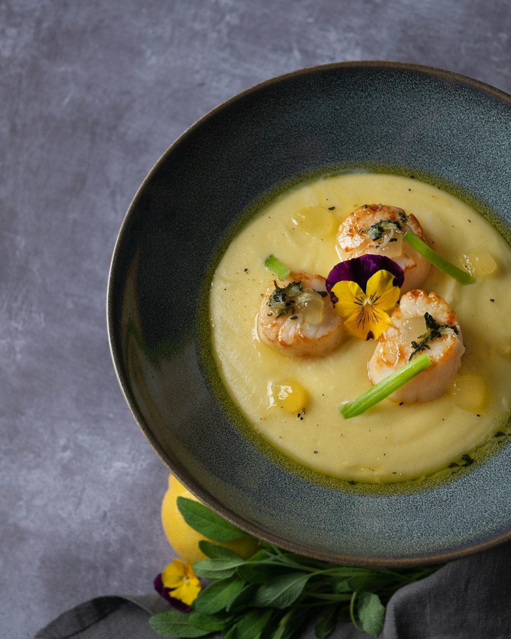 soup in black ceramic bowl