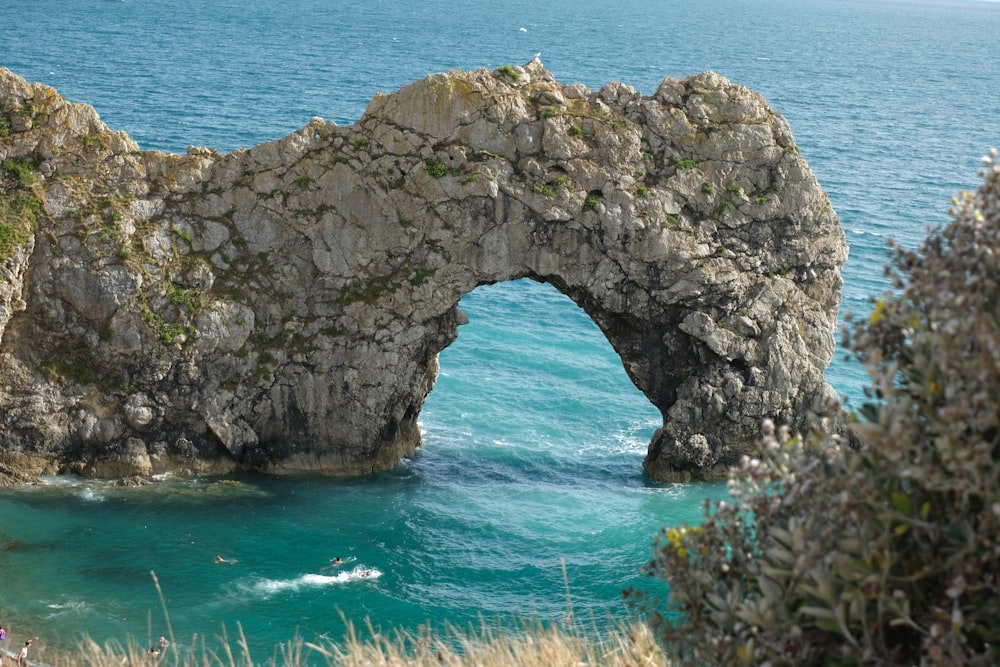 gray rock formation on blue sea during daytime