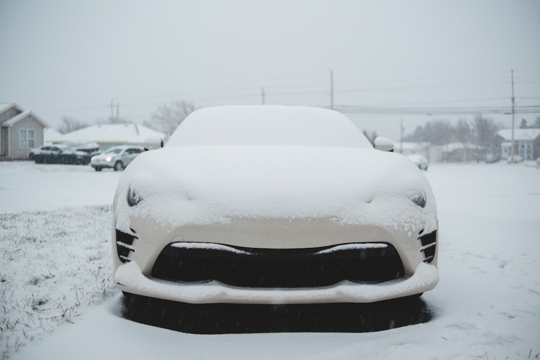 white car covered with snow