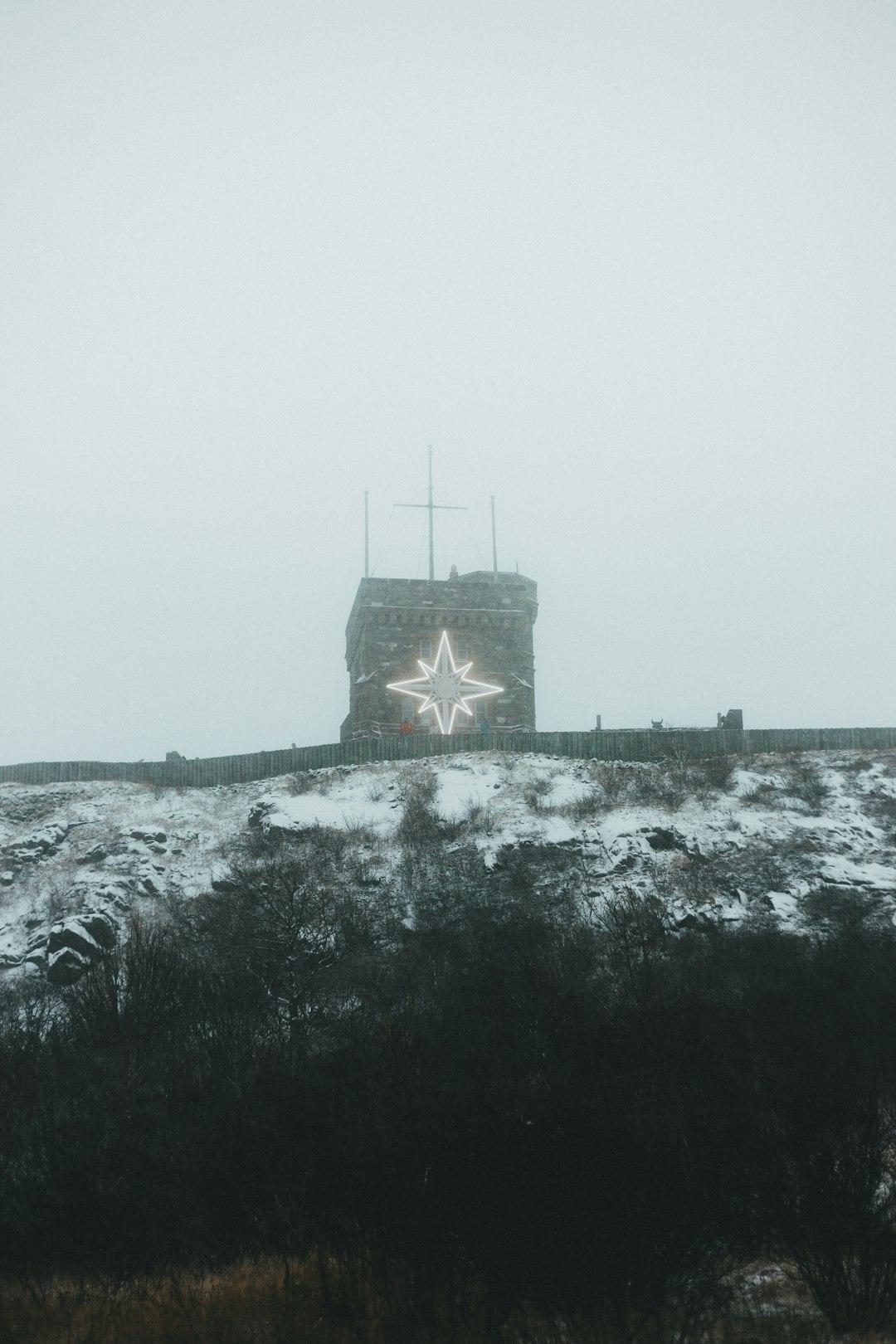 black castle on top of hill