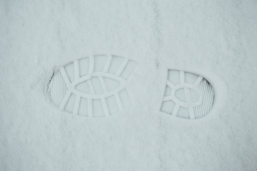 white round plastic cover on white textile