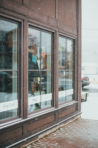 brown wooden framed glass window