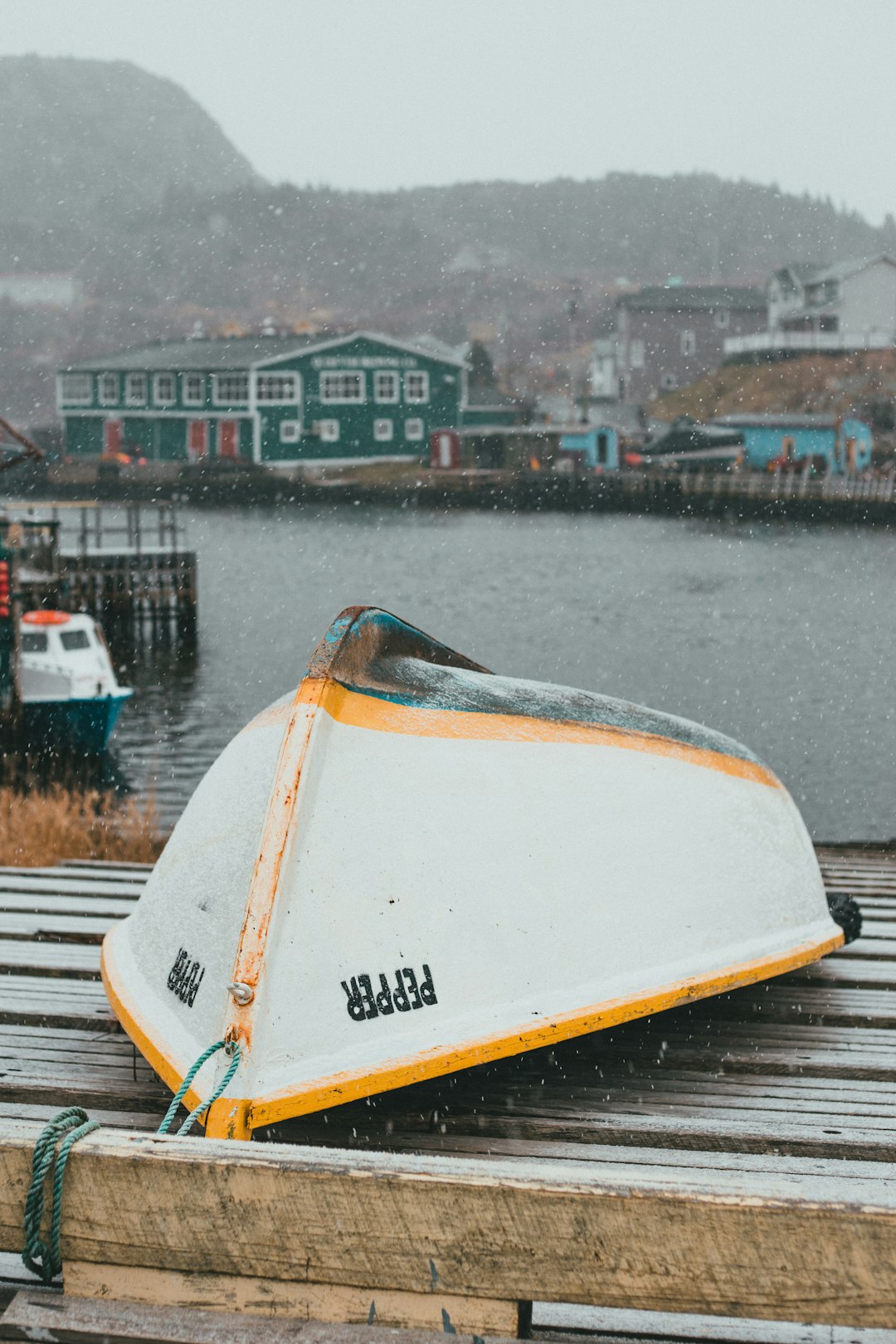 white and yellow boat on water