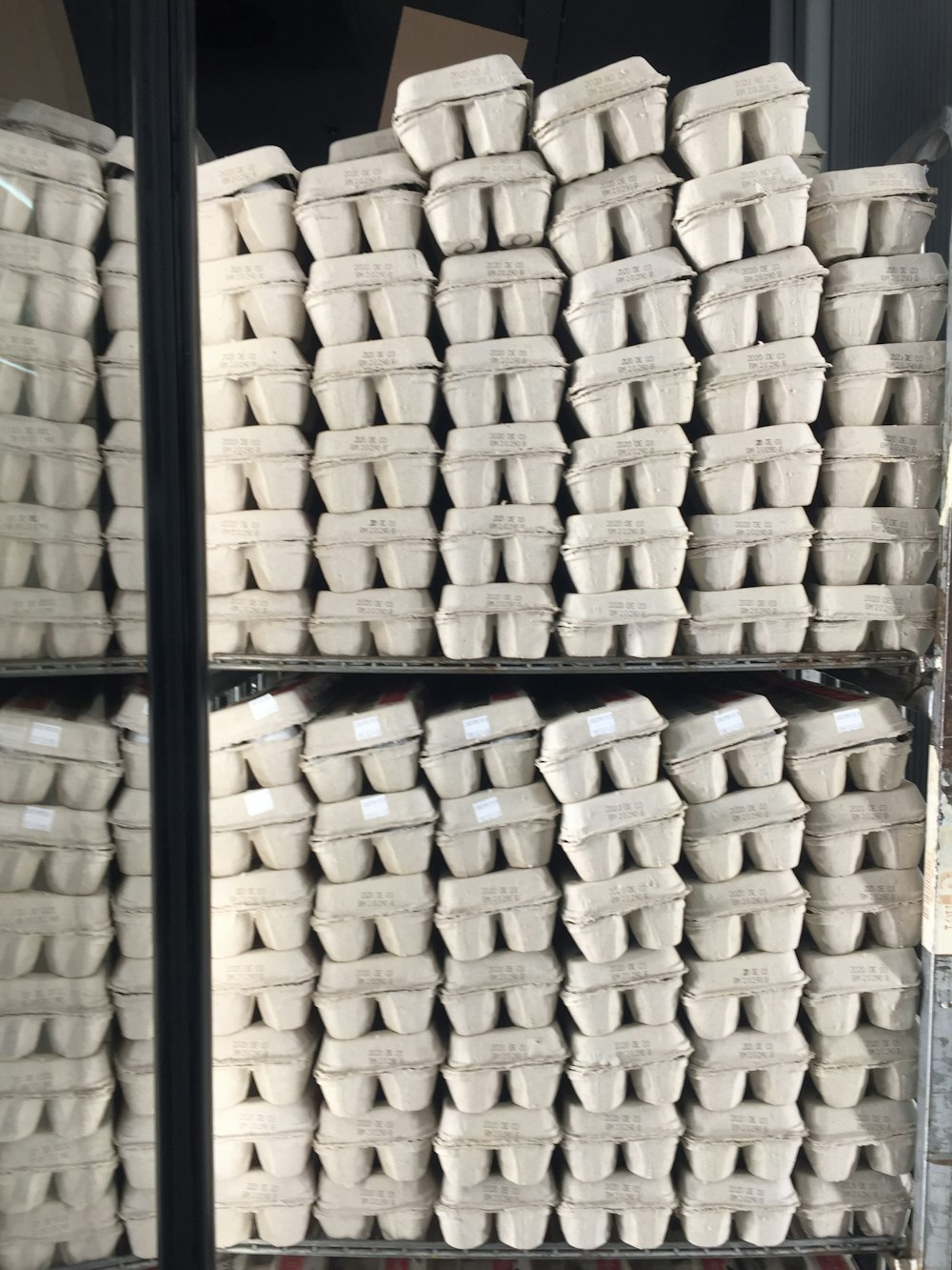 a bunch of white cups stacked on top of each other