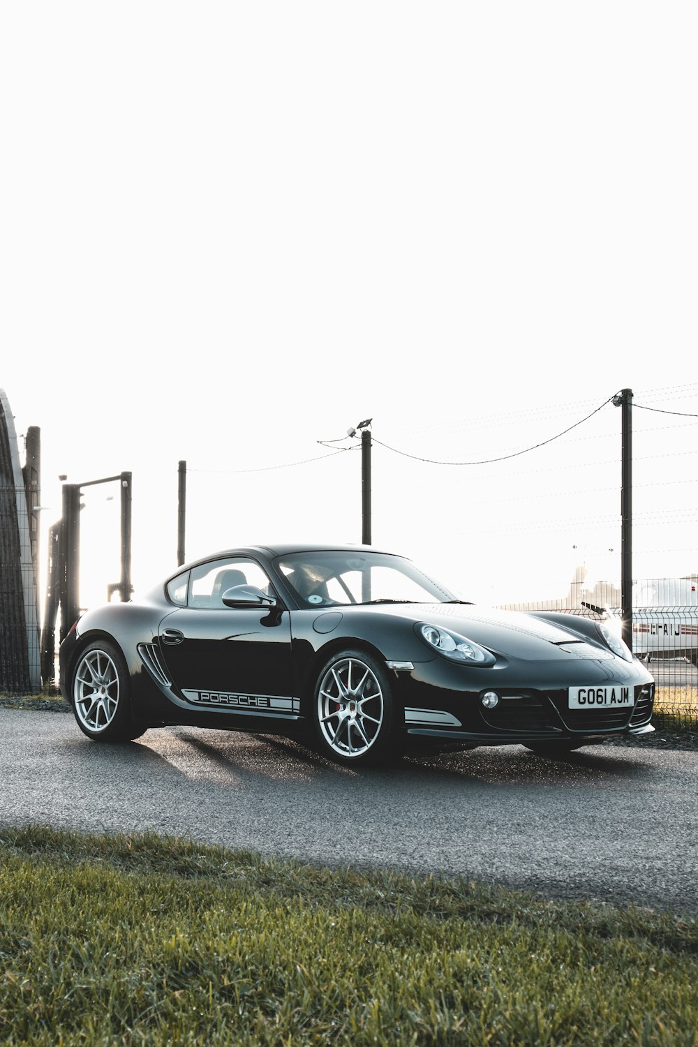 a black sports car parked on the side of the road