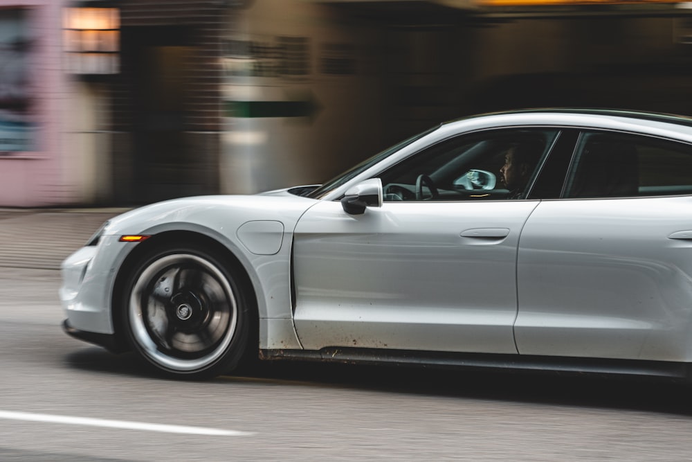 silver sedan on road during daytime