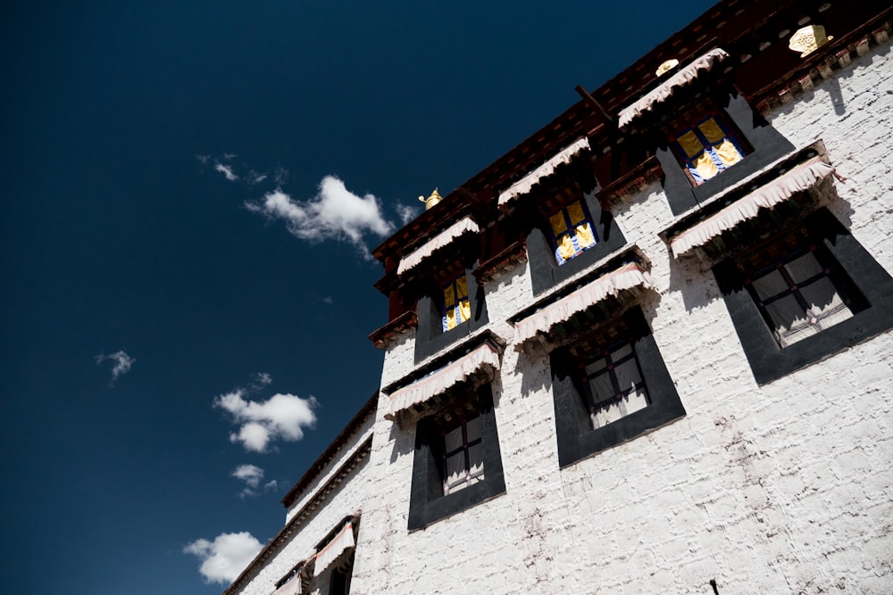 white concrete building under blue sky during daytime