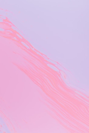 Soft pastel pink and lavender abstract shapes flowing gently across the screen.