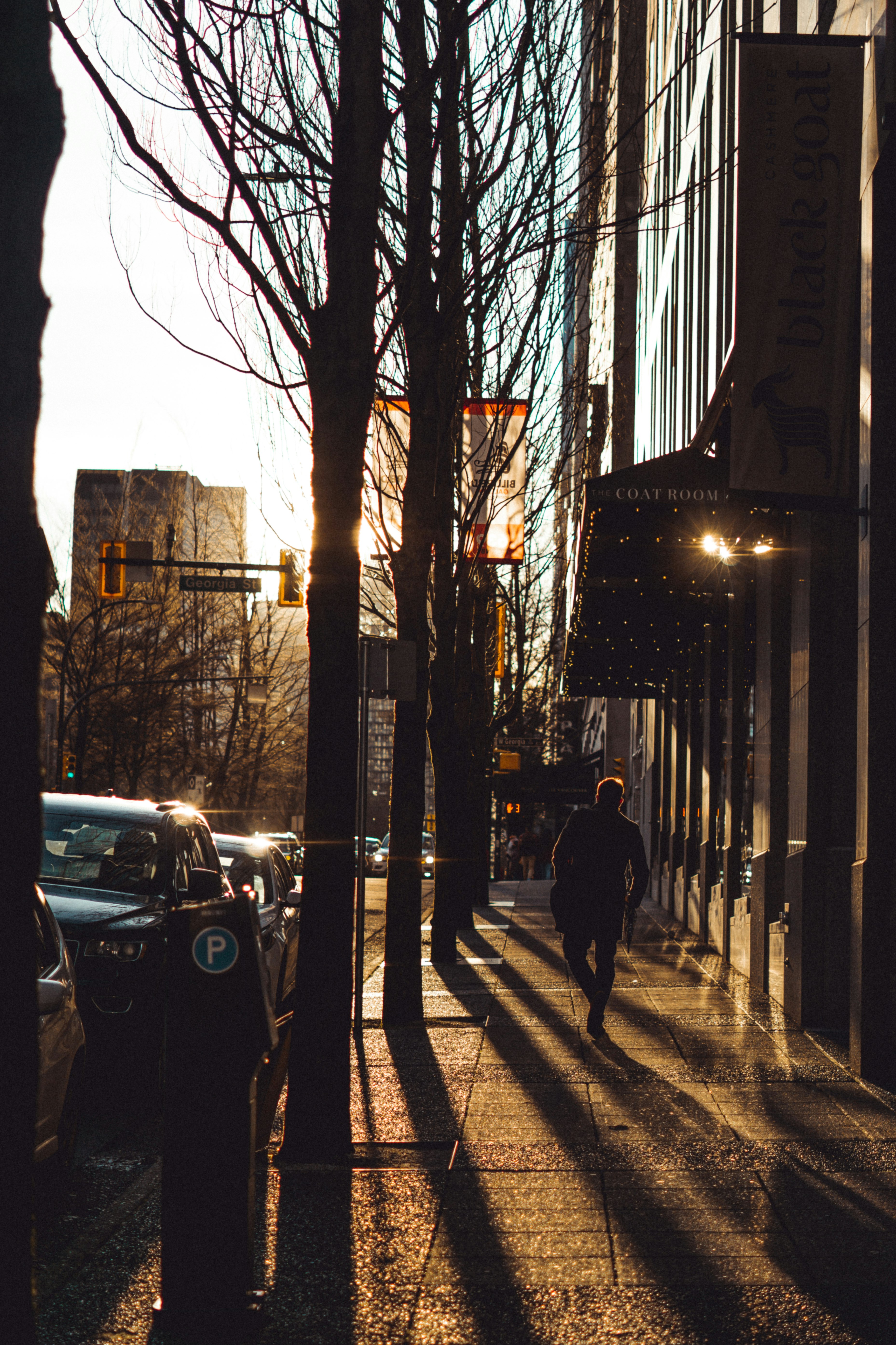 people walking on sidewalk during night time