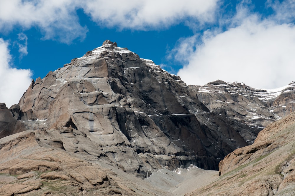 gray rocky mountain under blue sky during daytime