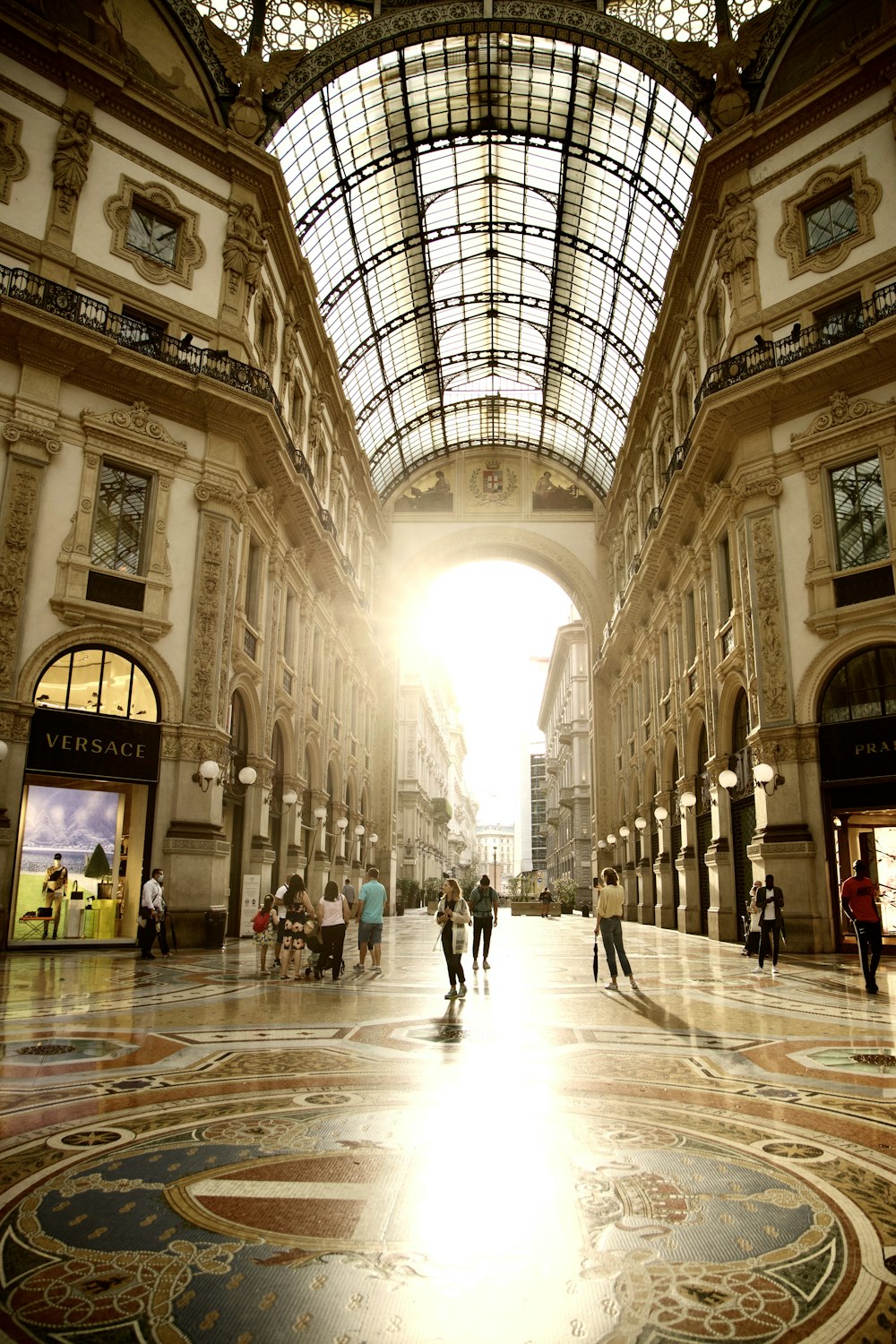 people walking on white and brown tiled floor