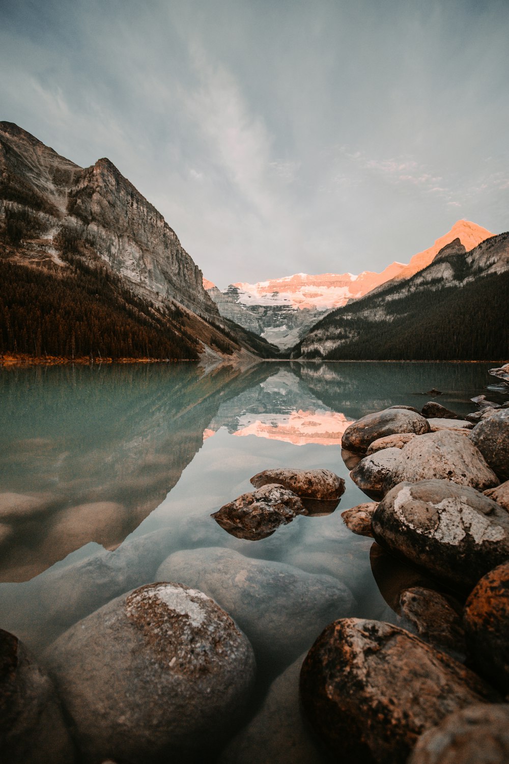 lake in the middle of rocky mountains