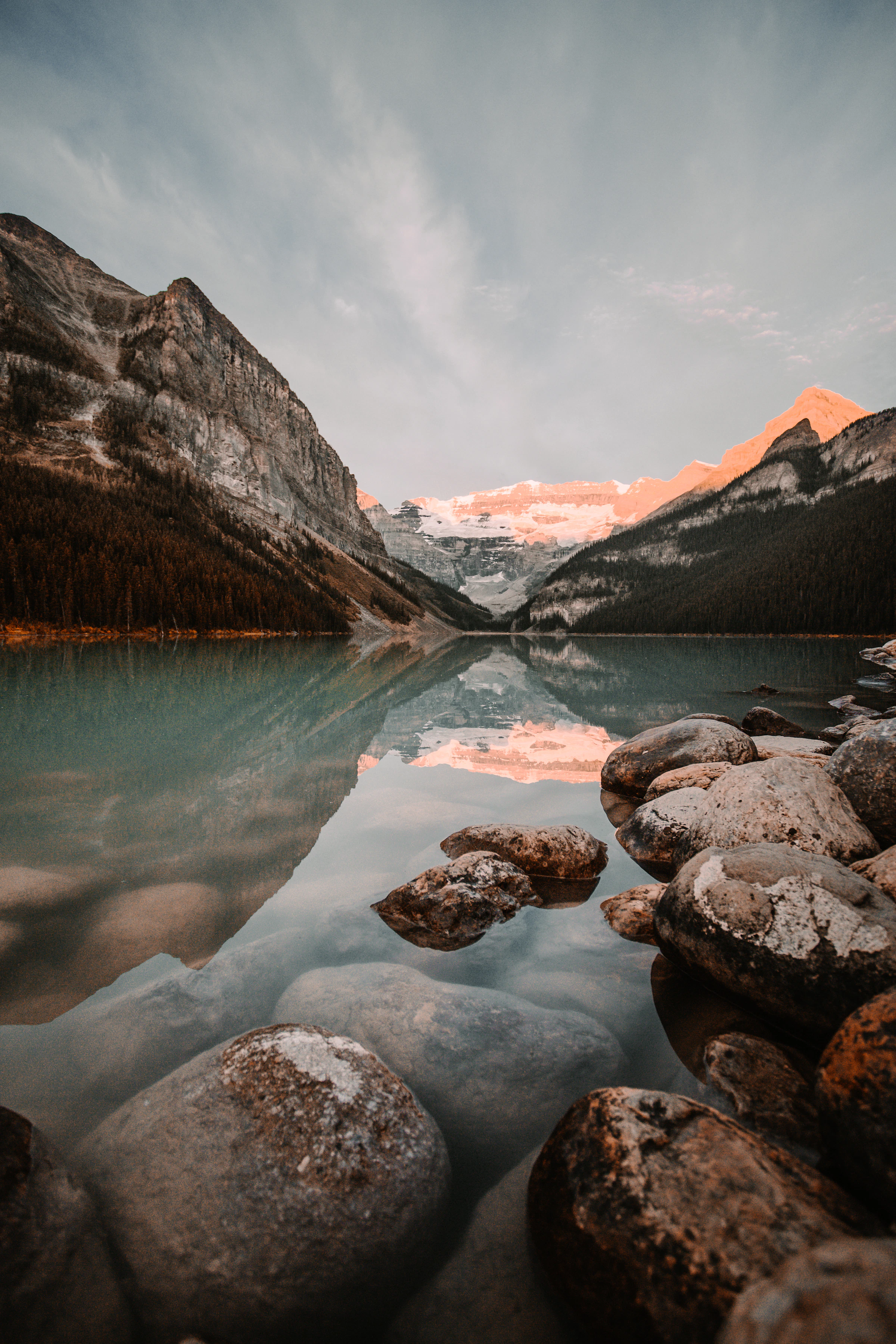 Mountain peaks reflected in a blue alpine lake