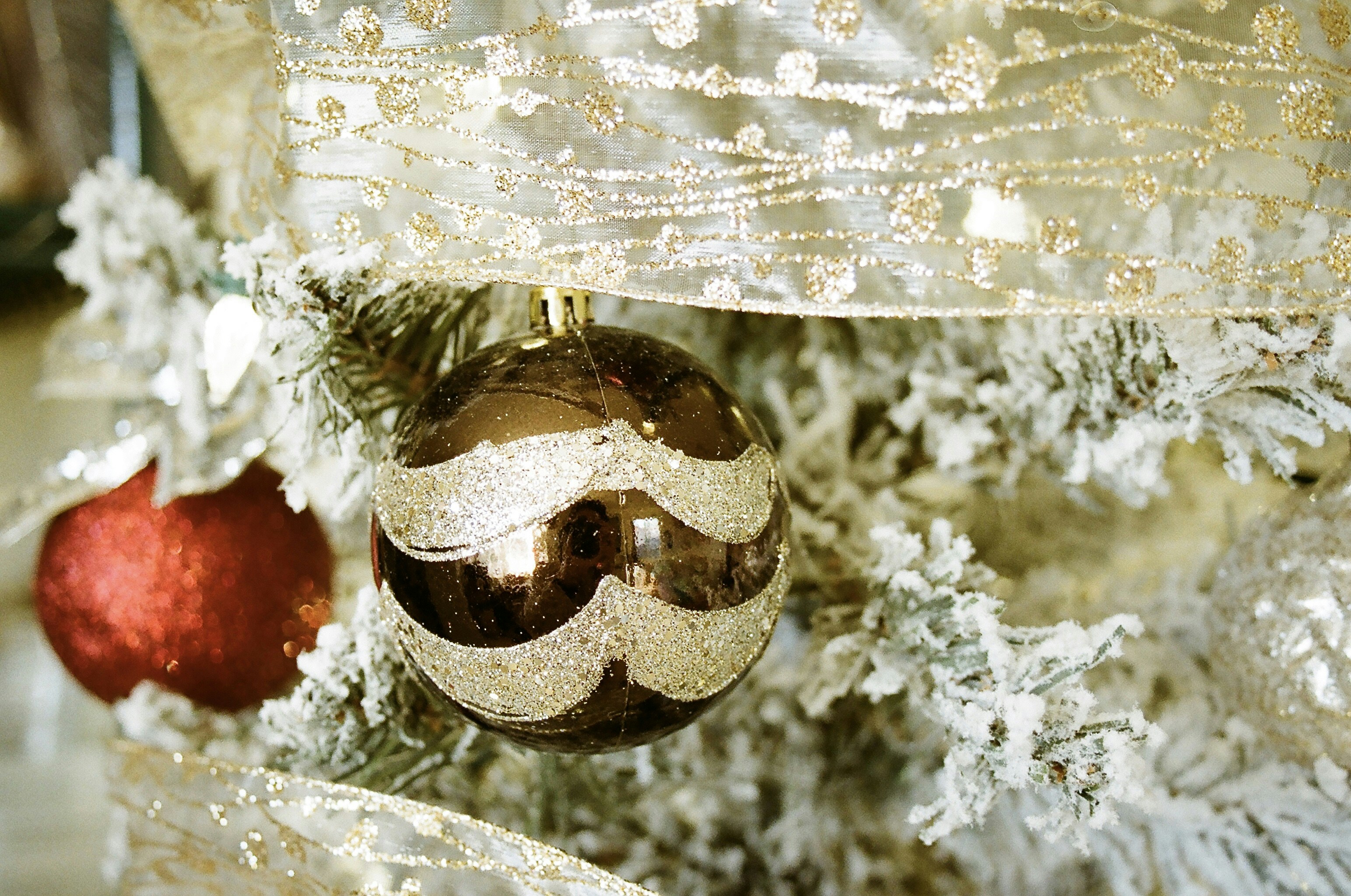 gold bauble on white textile