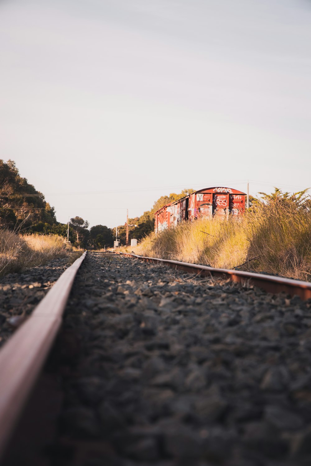 train rail near brown building during daytime