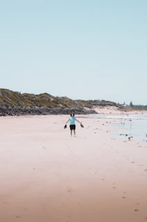 Men wearing lightweight EVA thongs walking along a rocky Australian coastline