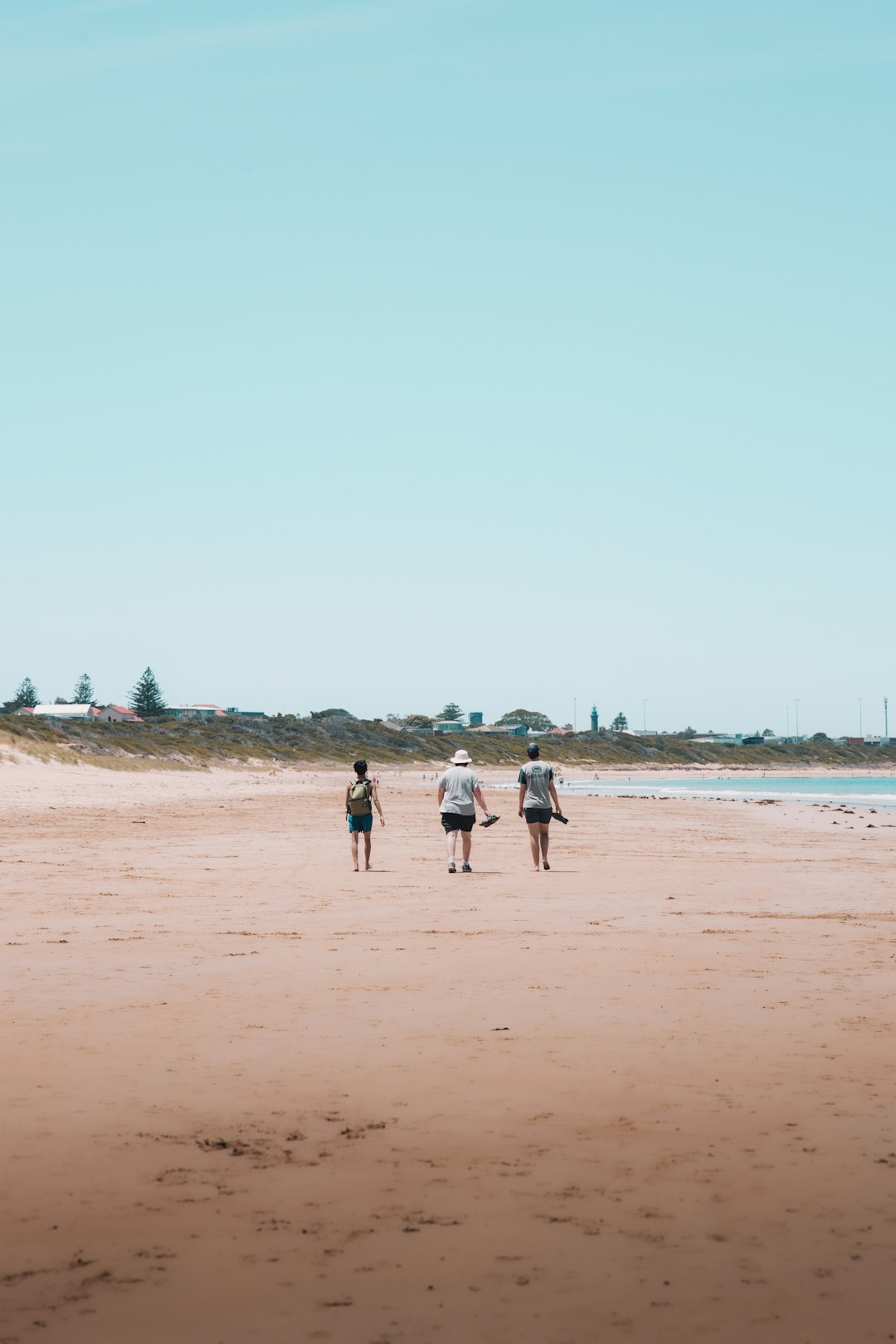 people walking on beach during daytime