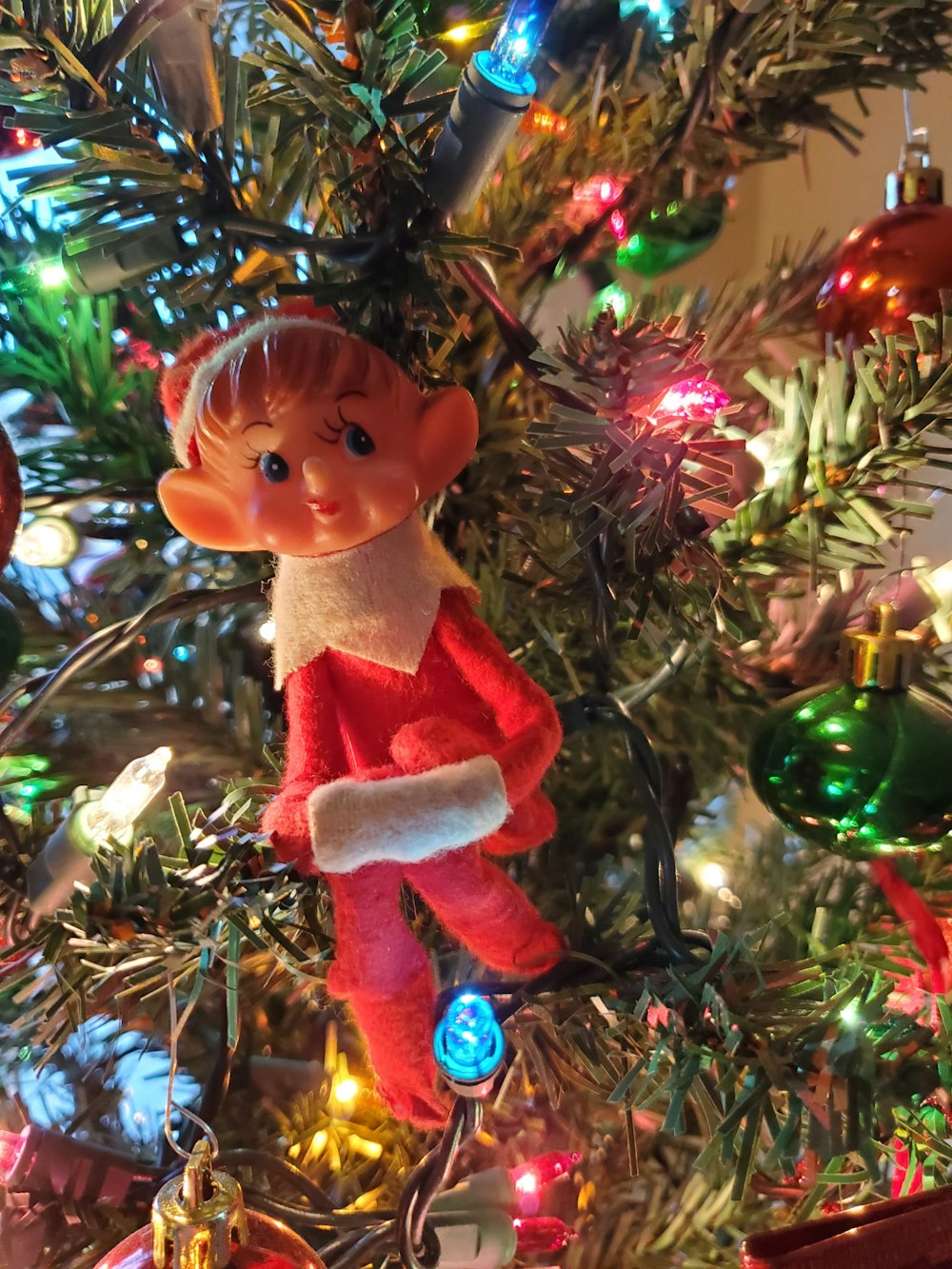 brown haired girl in red and white dress figurine