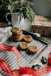 cookies on black tray beside brown cookies
