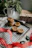 A cozy kitchen scene with freshly baked cookies on a cooling rack.