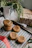 A rustic wooden table with an assortment of freshly baked cookies and a handwritten thank-you note.