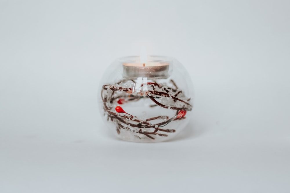 clear glass jar with white light